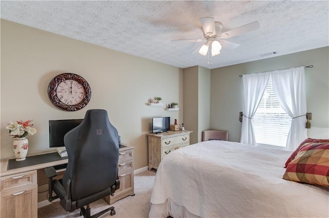 3370 Battlement Cir, Loganville, GA 30052 - bedroom with light colored carpet, a desk, a textured ceiling, and ceiling fan