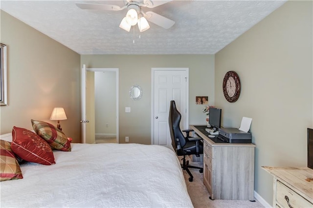 3370 Battlement Cir, Loganville, GA 30052 - bedroom featuring light carpet, a desk, a textured ceiling, and a ceiling fan
