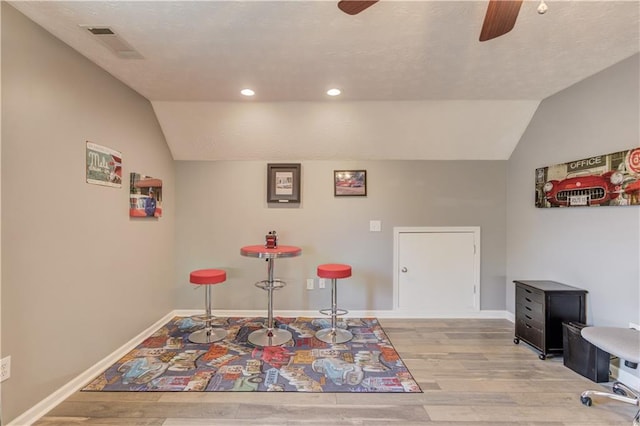 3370 Battlement Cir, Loganville, GA 30052 - dining area with a ceiling fan, vaulted ceiling, light wood-style floors, and recessed lighting