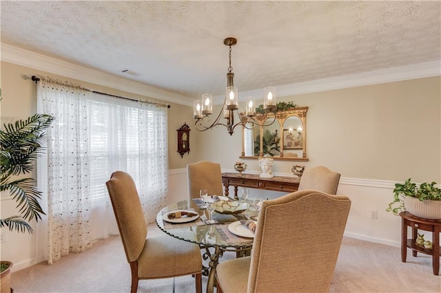 3370 Battlement Cir, Loganville, GA 30052 - dining area featuring light carpet, a chandelier, ornamental molding, and a textured ceiling