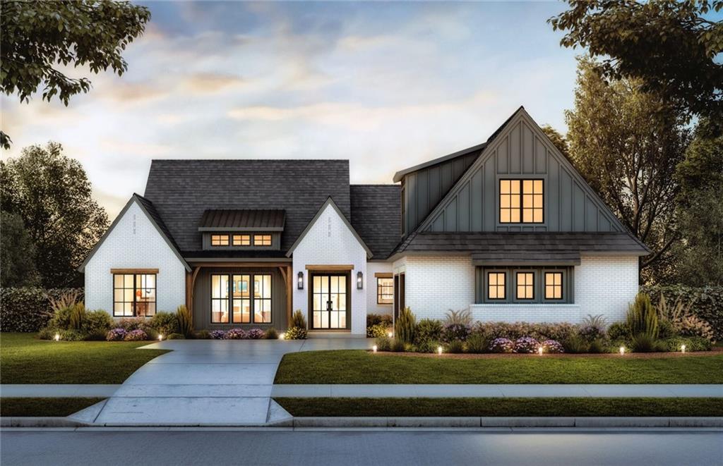 view of front of home featuring a lawn and french doors