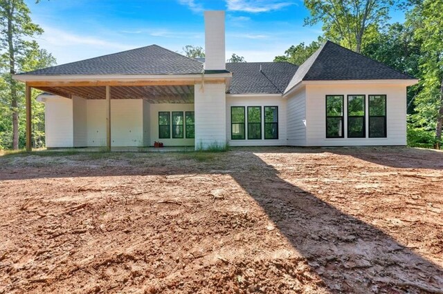 107 Marks Way, Canton, GA 30115 - rear view of house featuring a chimney, central AC unit, and roof with shingles