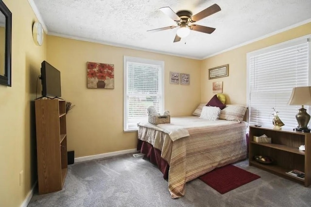 bedroom with crown molding, dark carpet, a textured ceiling, and ceiling fan