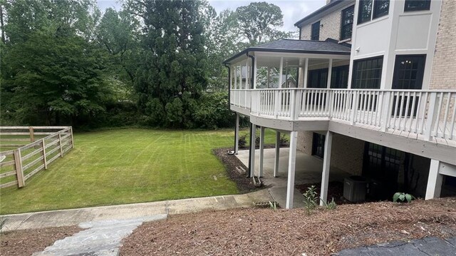 805 Wesley Oak Rd, Sandy Springs, GA 30328 - view of green lawn with a wooden deck and a patio area