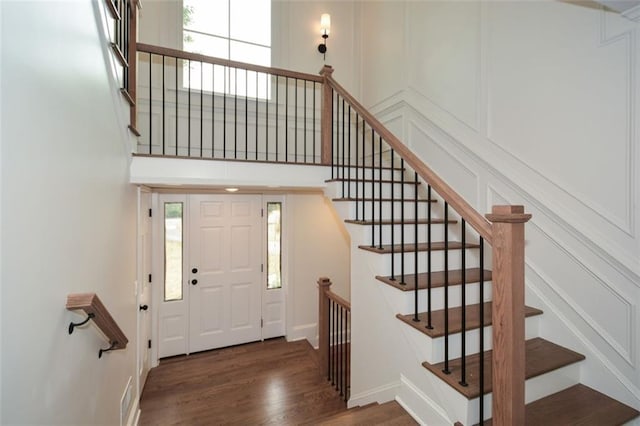 805 Wesley Oak Rd, Sandy Springs, GA 30328 - foyer featuring wood finished floors, stairway, plenty of natural light, and a towering ceiling