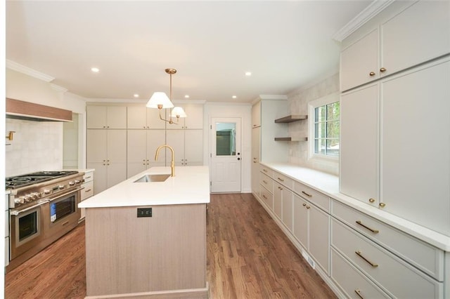 805 Wesley Oak Rd, Sandy Springs, GA 30328 - kitchen featuring ornamental molding, range with two ovens, decorative backsplash, recessed lighting, and wood finished floors