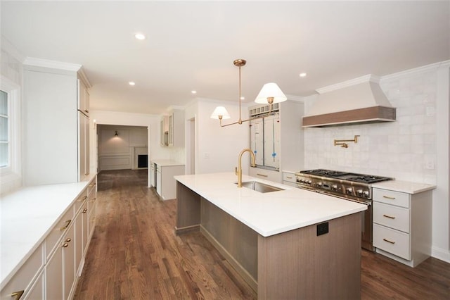 805 Wesley Oak Rd, Sandy Springs, GA 30328 - kitchen with premium range hood, range with two ovens, decorative backsplash, an island with sink, and dark wood-type flooring