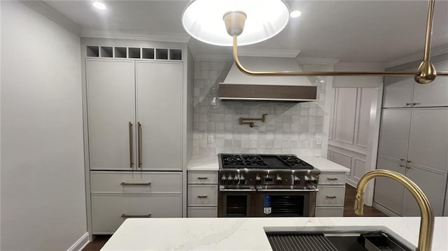 805 Wesley Oak Rd, Sandy Springs, GA 30328 - kitchen featuring double oven range, ornamental molding, tasteful backsplash, and wall chimney range hood