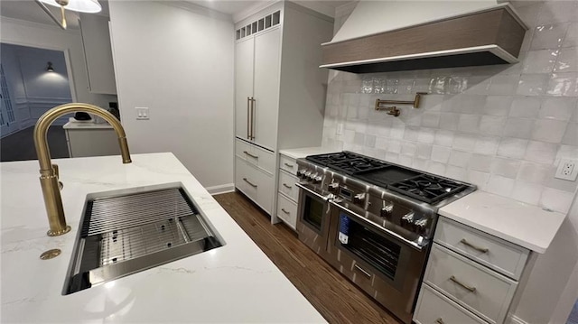 805 Wesley Oak Rd, Sandy Springs, GA 30328 - kitchen featuring range with two ovens, custom range hood, backsplash, dark wood-style floors, and open shelves
