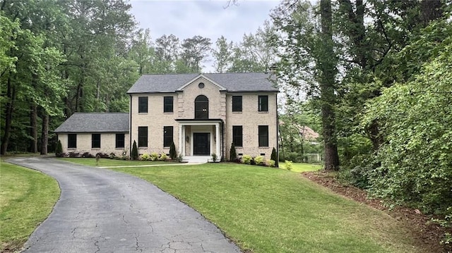 805 Wesley Oak Rd, Sandy Springs, GA 30328 - colonial home with a front lawn, brick siding, and asphalt driveway