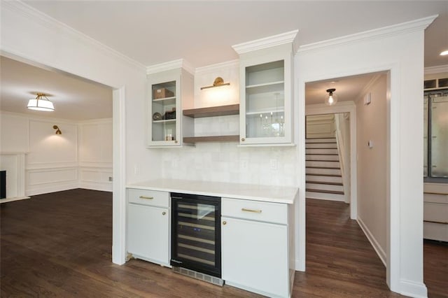 805 Wesley Oak Rd, Sandy Springs, GA 30328 - indoor dry bar with wine cooler, ornamental molding, backsplash, dark wood finished floors, and stairs