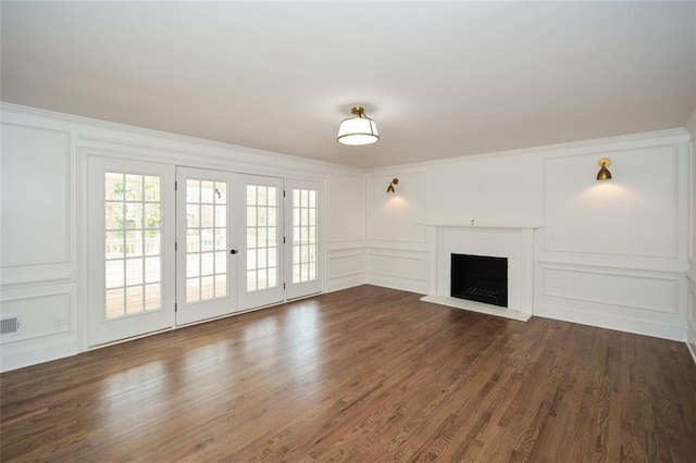 805 Wesley Oak Rd, Sandy Springs, GA 30328 - unfurnished living room featuring a decorative wall, dark wood-type flooring, a fireplace, and ornamental molding