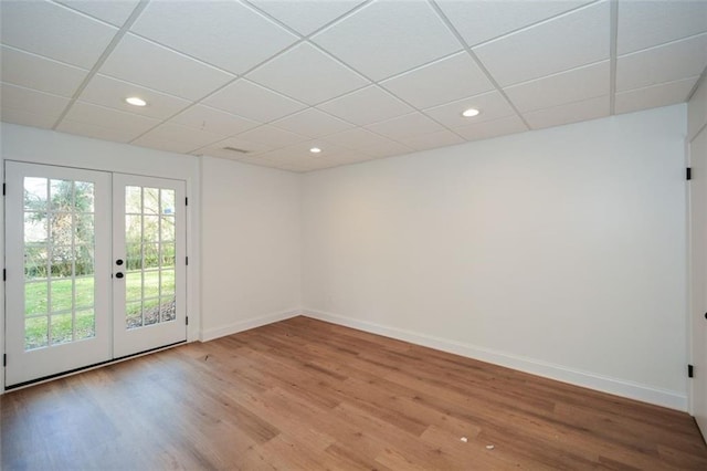 805 Wesley Oak Rd, Sandy Springs, GA 30328 - unfurnished room featuring french doors, a paneled ceiling, light wood-style flooring, and recessed lighting