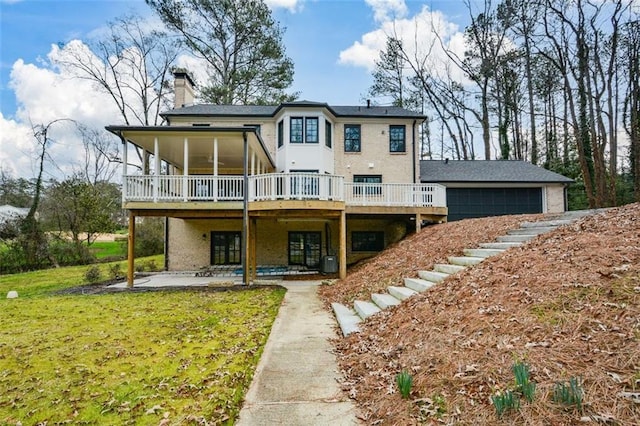 805 Wesley Oak Rd, Sandy Springs, GA 30328 - rear view of house with a patio, a wooden deck, a chimney, and a yard