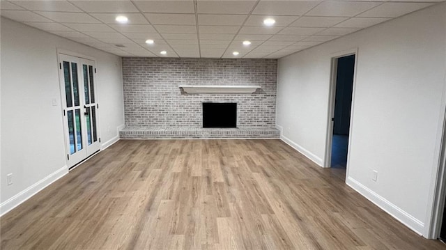 805 Wesley Oak Rd, Sandy Springs, GA 30328 - unfurnished living room featuring wood finished floors, a fireplace, a paneled ceiling, and recessed lighting