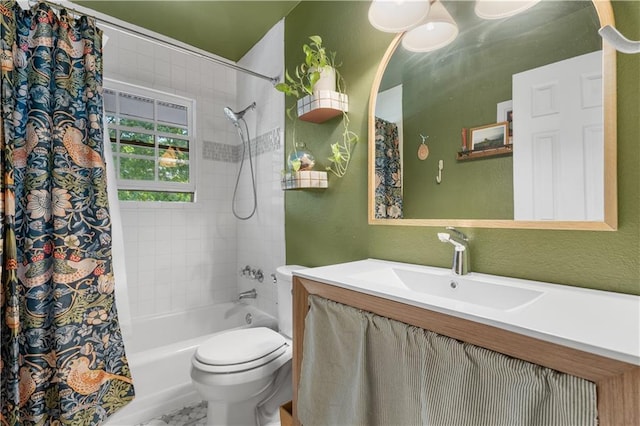 bathroom with vanity, toilet, a textured wall, and shower / bath combo