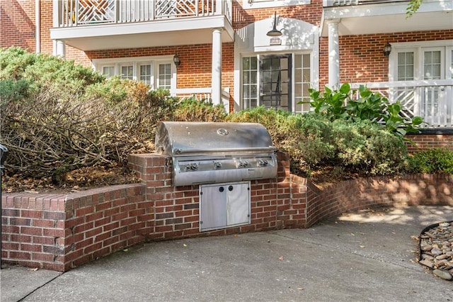 view of patio / terrace featuring a balcony and area for grilling