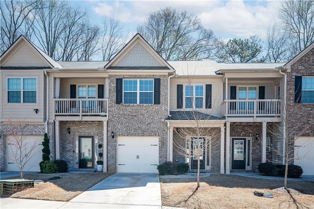2544 Castellan Dr, Atlanta, GA 30316 - view of front of property with a balcony, concrete driveway, and brick siding