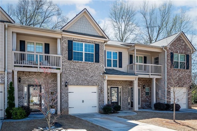 2544 Castellan Dr, Atlanta, GA 30316 - view of front facade with a balcony, an attached garage, concrete driveway, and brick siding