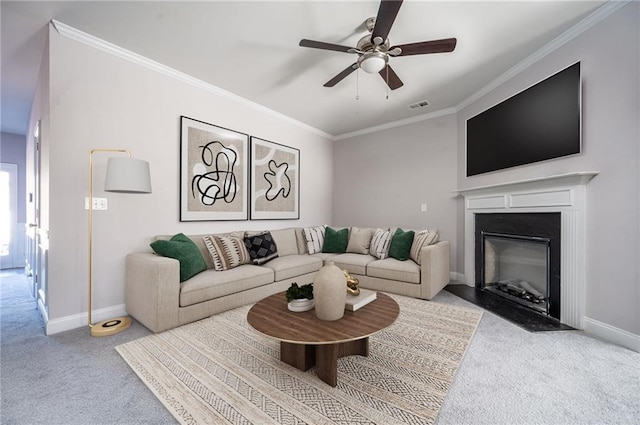 2544 Castellan Dr, Atlanta, GA 30316 - living room featuring carpet flooring, a ceiling fan, baseboards, crown molding, and a fireplace with flush hearth