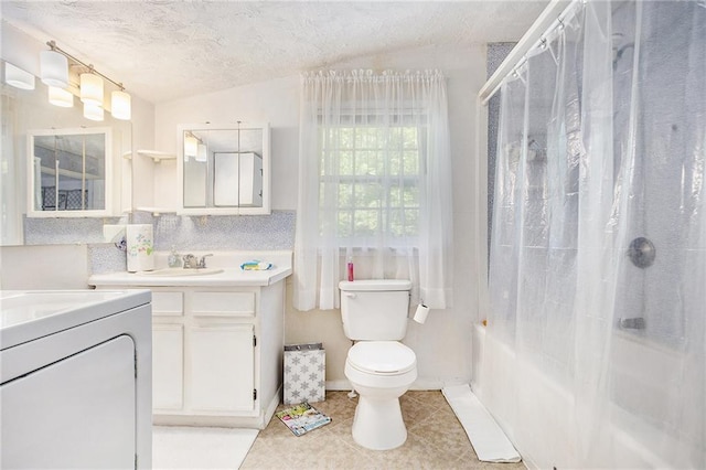 4329 Park St, Acworth, GA 30101 - full bathroom featuring vanity, tile patterned floors, washer / dryer, shower / bath combination with glass door, and a textured ceiling