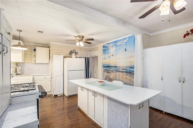 4329 Park St, Acworth, GA 30101 - kitchen with white appliances, a ceiling fan, ornamental molding, and light countertops