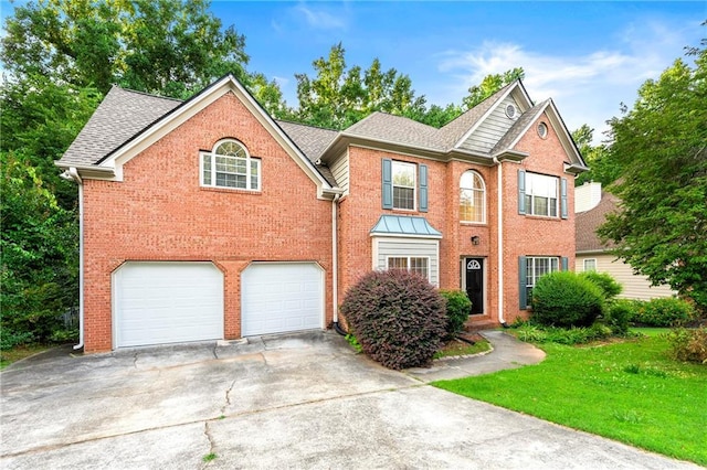 2004 Township Dr, Woodstock, GA 30189 - view of front of property with brick siding, a garage, driveway, and roof with shingles