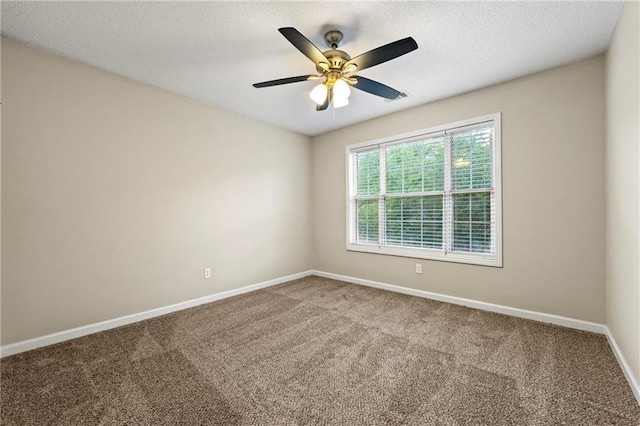 2004 Township Dr, Woodstock, GA 30189 - spare room featuring carpet flooring, ceiling fan, and a textured ceiling