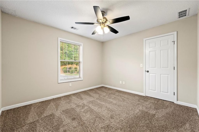 2004 Township Dr, Woodstock, GA 30189 - carpeted empty room with a ceiling fan and a textured ceiling