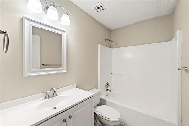 2004 Township Dr, Woodstock, GA 30189 - bathroom featuring vanity, a textured ceiling, and shower / washtub combination