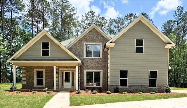121 Honey Creek Rd, Conyers, GA 30094 - craftsman-style house with brick siding, covered porch, and a front lawn