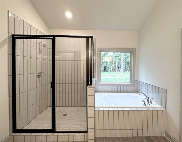 121 Honey Creek Rd, Conyers, GA 30094 - full bathroom featuring a bath, a stall shower, and lofted ceiling