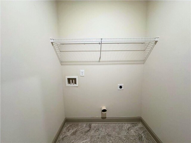121 Honey Creek Rd, Conyers, GA 30094 - clothes washing area featuring baseboards, hookup for an electric dryer, hookup for a washing machine, and laundry area