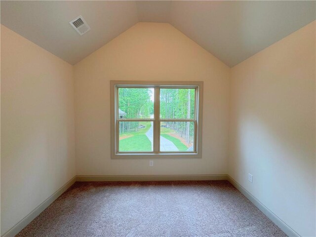 121 Honey Creek Rd, Conyers, GA 30094 - spare room with lofted ceiling, baseboards, visible vents, and carpet floors