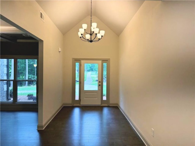 121 Honey Creek Rd, Conyers, GA 30094 - foyer with a wealth of natural light, dark wood-style floors, visible vents, and a chandelier
