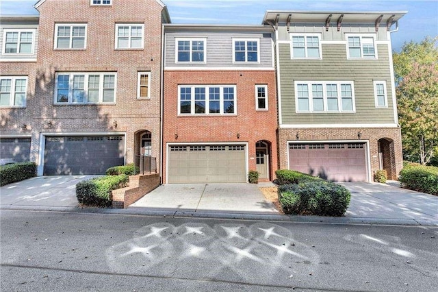 multi unit property featuring a garage