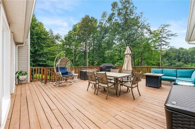 deck with an outdoor living space and outdoor dining area