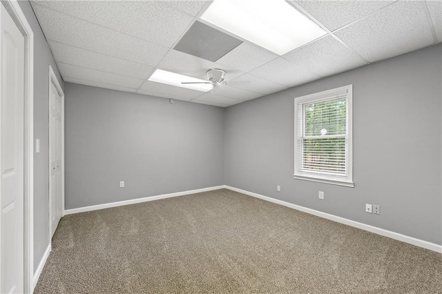 unfurnished room featuring baseboards, a ceiling fan, and carpet flooring