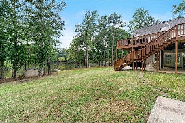 view of yard with stairs, a storage shed, a deck, and an outdoor structure