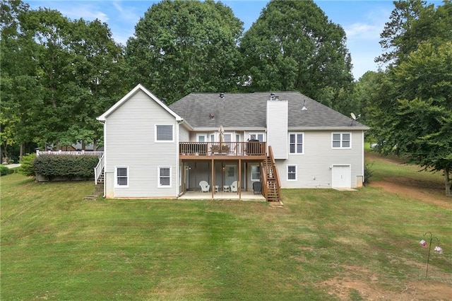 rear view of house featuring stairway, a patio, a lawn, and a deck