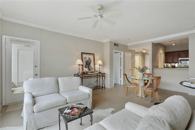 living room with visible vents, ornamental molding, and ceiling fan