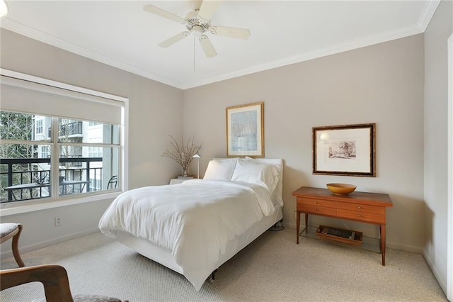 bedroom with light colored carpet, crown molding, baseboards, and ceiling fan