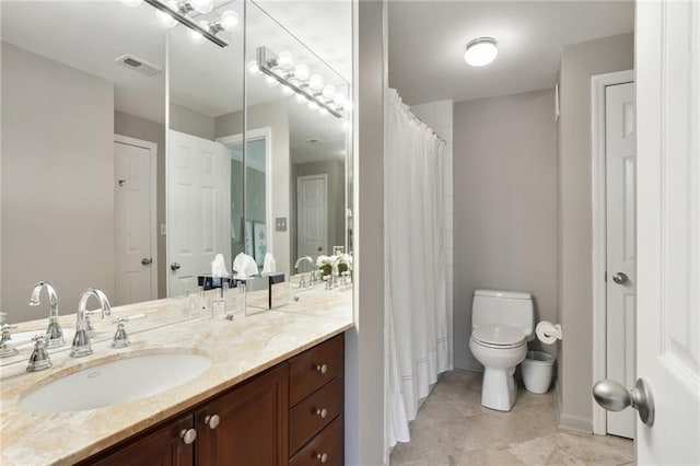 full bathroom featuring toilet, visible vents, a closet, and vanity