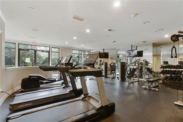 exercise room featuring baseboards, visible vents, and recessed lighting