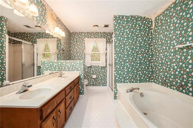 bathroom featuring wallpapered walls, a shower stall, a garden tub, tile patterned floors, and double vanity