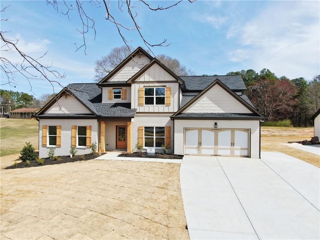 view of front of house with a garage, concrete driveway, roof with shingles, and board and batten siding