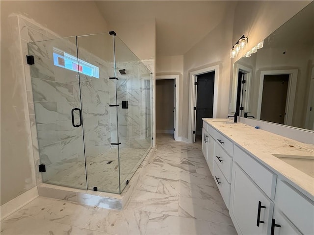 bathroom featuring double vanity, a marble finish shower, baseboards, marble finish floor, and a sink