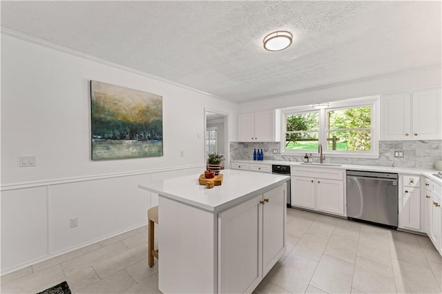 220 Hollyridge Dr, Roswell, GA 30076 - kitchen featuring dishwasher, backsplash, light countertops, a kitchen island, and white cabinetry