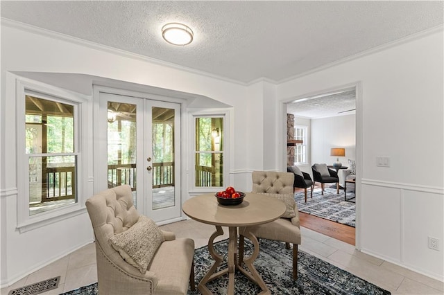 220 Hollyridge Dr, Roswell, GA 30076 - dining room featuring french doors, a textured ceiling, ornamental molding, and light tile patterned flooring
