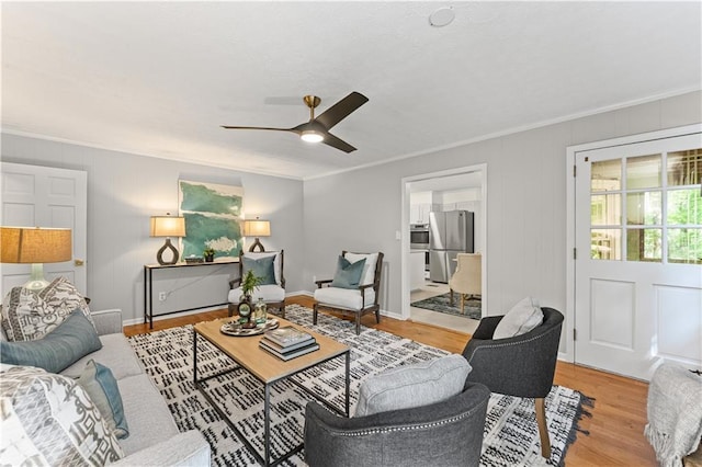220 Hollyridge Dr, Roswell, GA 30076 - living room with light wood-style flooring, a ceiling fan, and ornamental molding